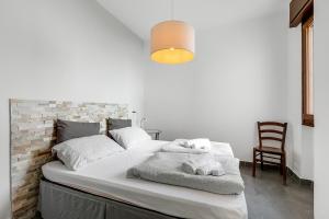 Posteľ alebo postele v izbe v ubytovaní Casa dei Nonni Apartments