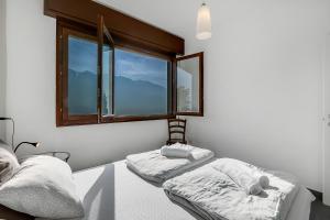 Posteľ alebo postele v izbe v ubytovaní Casa dei Nonni Apartments