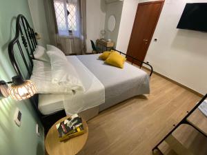 Postel nebo postele na pokoji v ubytování Corte Prini Fiumicino + 16 fotografií