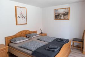 Postel nebo postele na pokoji v ubytování Hiša Bistrica