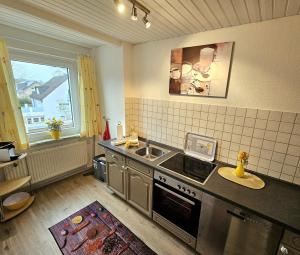 Kuchyň nebo kuchyňský kout v ubytování Revenstorf Wohnung 2 + 12 fotografií
