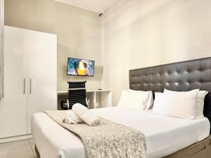 Postel nebo postele na pokoji v ubytování Angel Boutique Hotel