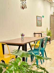 a dining room with a wooden table and chairs at Encanto 3 in Santa Rosa de Cabal