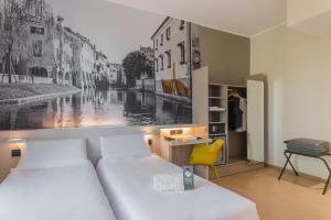Postel nebo postele na pokoji v ubytování B&B Hotel Treviso