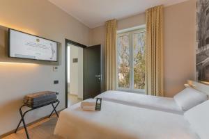 Postel nebo postele na pokoji v ubytování B&B Hotel Treviso