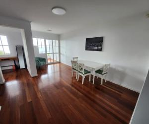 a dining room with a table and chairs at The Garajau Views in Caniço