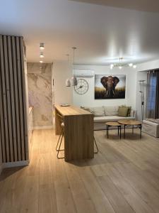 a living room with a couch and a table at Acojedor piso en corason Santa Pola in Santa Pola