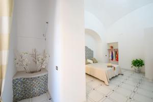Katil atau katil-katil dalam bilik di AntonelloApartments - La casa del pozzo +3 gambar