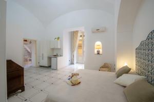 Katil atau katil-katil dalam bilik di AntonelloApartments - La casa del pozzo