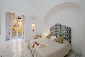 Katil atau katil-katil dalam bilik di AntonelloApartments - La casa del pozzo