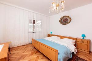 Postel nebo postele na pokoji v ubytování Apartments Marija 1921