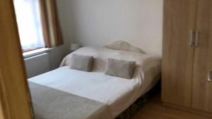 A bed or beds in a room at Rita-Vár Szálláshely