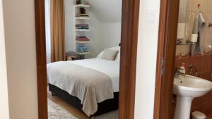 A bed or beds in a room at Rita-Vár Szálláshely