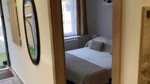 A bed or beds in a room at Rita-Vár Szálláshely