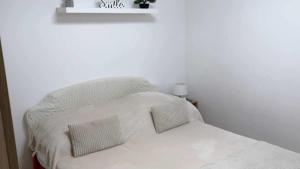A bed or beds in a room at Rita-Vár Szálláshely