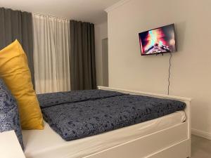 Ένα ή περισσότερα κρεβάτια σε δωμάτιο στο Apartment Ferienwohnung Leuna 2-room Apartement Second Home Gästezimmer