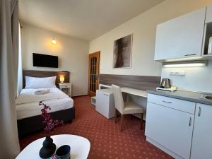Kuchyň nebo kuchyňský kout v ubytování Hotel Brixen
