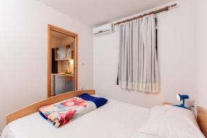 Postel nebo postele na pokoji v ubytování Apartments Marija 1921