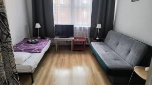 Postel nebo postele na pokoji v ubytování U Szermierzy