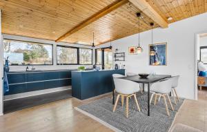 a kitchen and dining room with a table and chairs at Lovely Home In Ebeltoft With Wifi in Ebeltoft