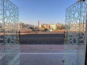 a metal gate with a view of a parking lot at فندق النخبة الماسي - Diamond Elite Hotel in Al Madinah