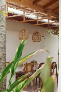 a dining room with a table and chairs at Remote Nest Cabins in Ahangama