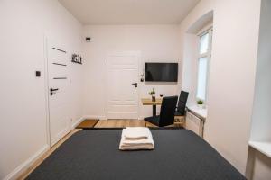 Televízia a/alebo spoločenská miestnosť v ubytovaní Best Place Apartment