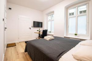 Posteľ alebo postele v izbe v ubytovaní Best Place Apartment