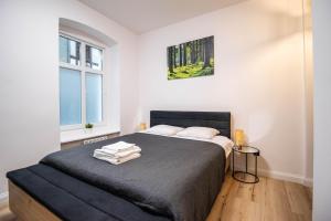 Posteľ alebo postele v izbe v ubytovaní Best Place Apartment
