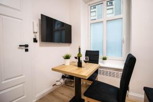 Televízia a/alebo spoločenská miestnosť v ubytovaní Best Place Apartment