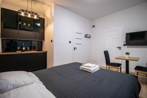Posteľ alebo postele v izbe v ubytovaní Best Place Apartment