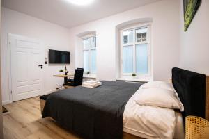 Posteľ alebo postele v izbe v ubytovaní Best Place Apartment