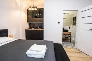 Posteľ alebo postele v izbe v ubytovaní Best Place Apartment