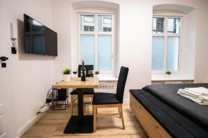 Televízia a/alebo spoločenská miestnosť v ubytovaní Best Place Apartment