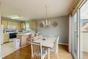 a kitchen with a table and chairs in a room at Summer Sun 8 in Ocean City
