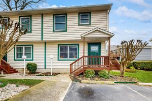 a large house with a porch and a deck at Summer Sun 8 in Ocean City