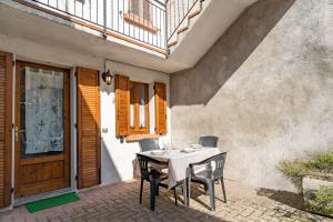 a table and chairs sitting on a patio at The Court of the moon in Barzio