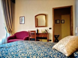 Postel nebo postele na pokoji v ubytování Hotel Il Cavalier D'Arpino