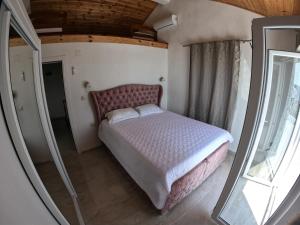 a bedroom with a bed and a mirror at Villa Vuk in Budva +47 photos