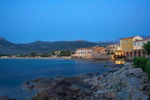 a view of a river in a town at night at Villa GiGa Algajola in Algajola