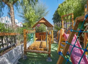 a playground with a slide and a swing set at Residence & Bed e Breakfast AlaMarina in Peschici