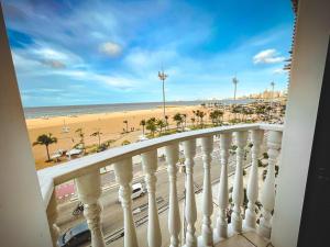 a balcony with a view of a beach and the ocean at Classic Residence in Fortaleza