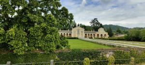 a large building with a garden in front of it at Ca del Parco in Montebelluna