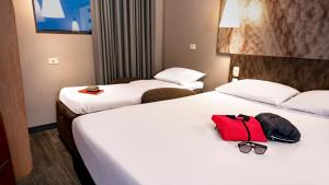 Ein Bett oder Betten in einem Zimmer der Unterkunft ibis Barranquilla