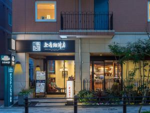 a building with a sign on the front of it at Sotetsu Fresa Inn Tokyo-Akasaka in Tokyo