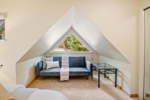 a room with a blue couch and a window at 31 GlenEagle in Whistler +52 photos