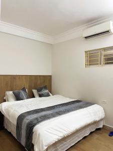 Postel nebo postele na pokoji v ubytování Airy Nest Hotel