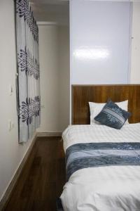 Postel nebo postele na pokoji v ubytování Airy Nest Hotel