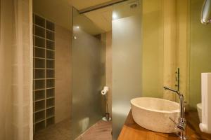 a bathroom with a large stone sink and a shower at Loft El Roure, El Vilosell in El Vilosell +7 photos