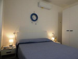 Ένα ή περισσότερα κρεβάτια σε δωμάτιο στο AffittaSardegna - Appartamento Gemma del Mare